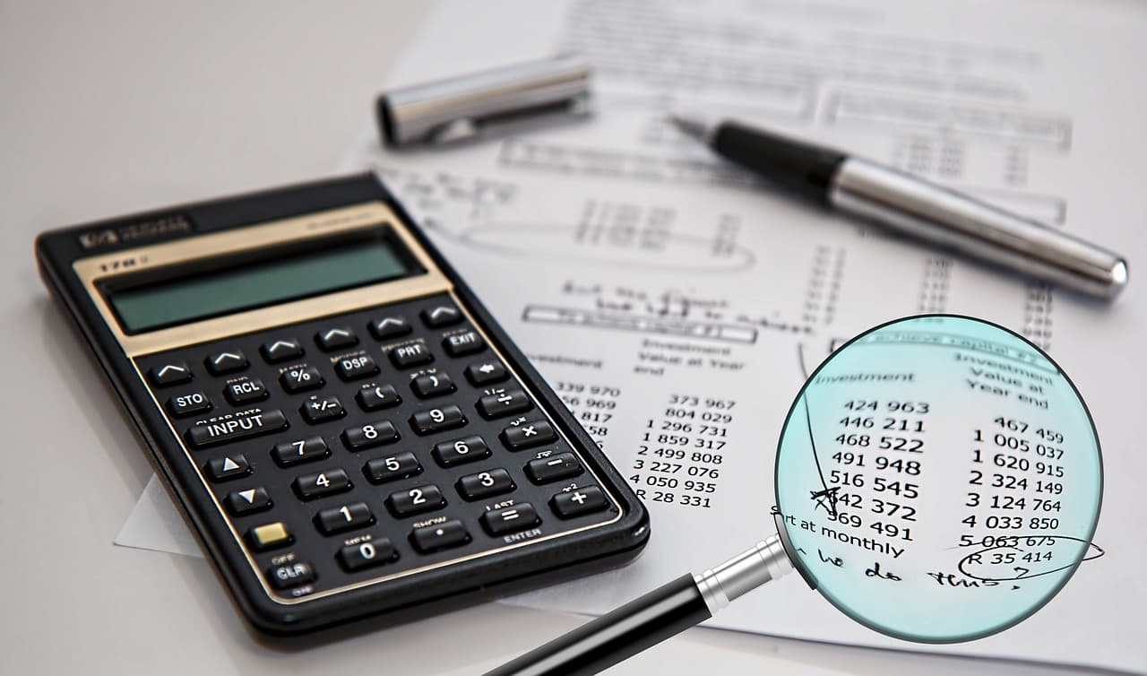 Magnifying glass over documents during an evidence review