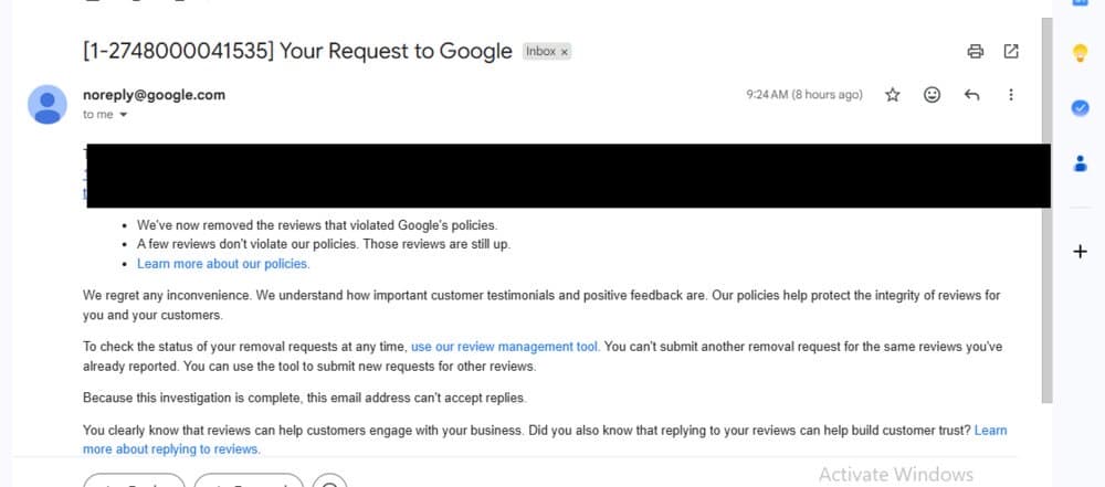 Redacted Google confirmation email stating reviews that violated policy have been removed, business name blacked out